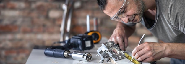 Free photo a carpenter in the process a professional tool for precision drilling in wood