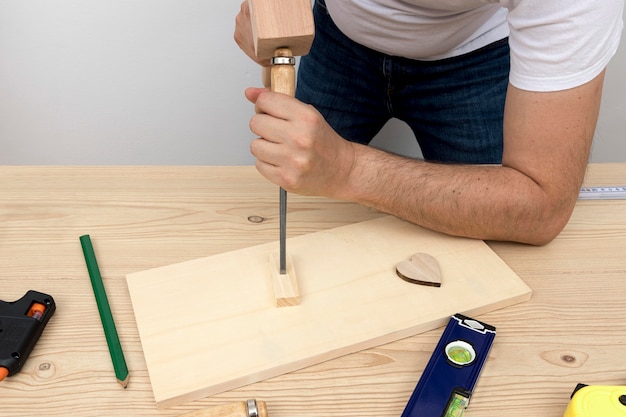 Free Photo carpenter worker creating home decoration from wood in his workshop