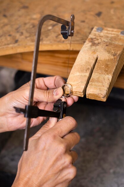 Carpenter worker creating a ring