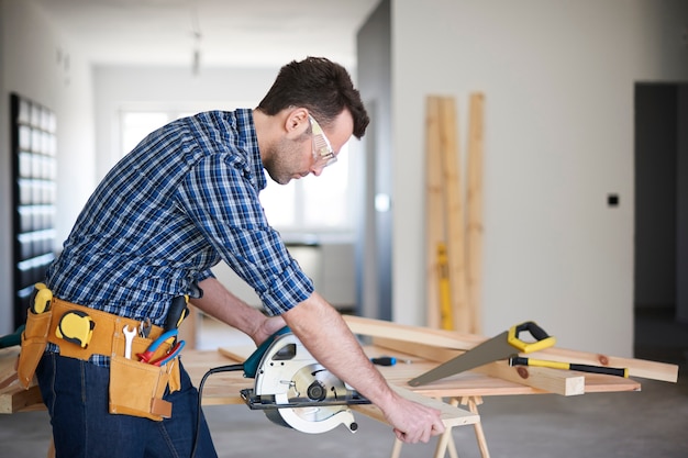 Carpenter working in a house