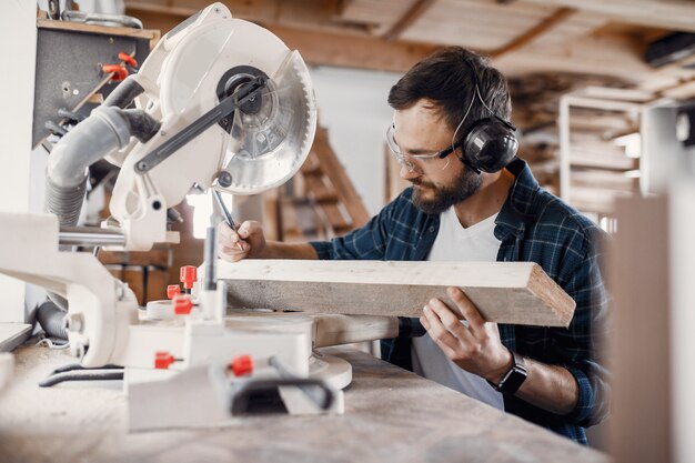 Carpenter working with circular saw