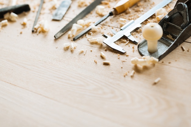 Free Photo carpentry tools on wooden table background