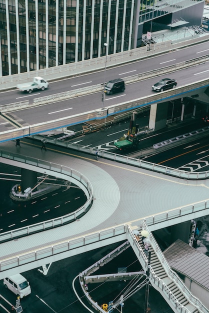 Cars on the road in the city during a cloudy day