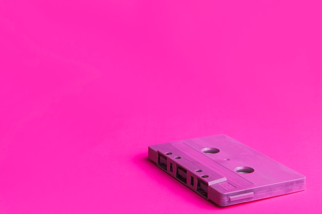 Cassette on magenta background