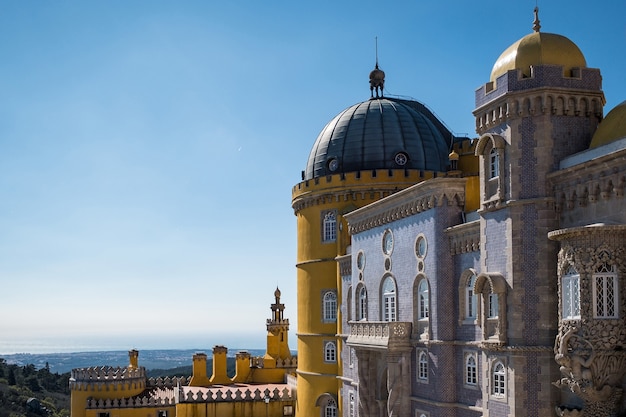 Castle in Sintra Cascais surrounded by greenery under the sunlight and a blue sky in Portugal