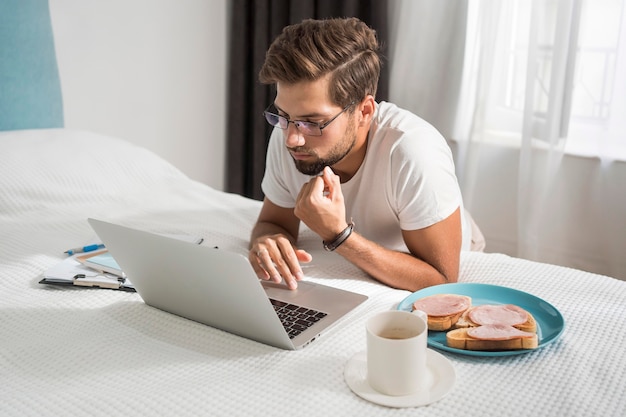 Casual adult male enjoying working at home