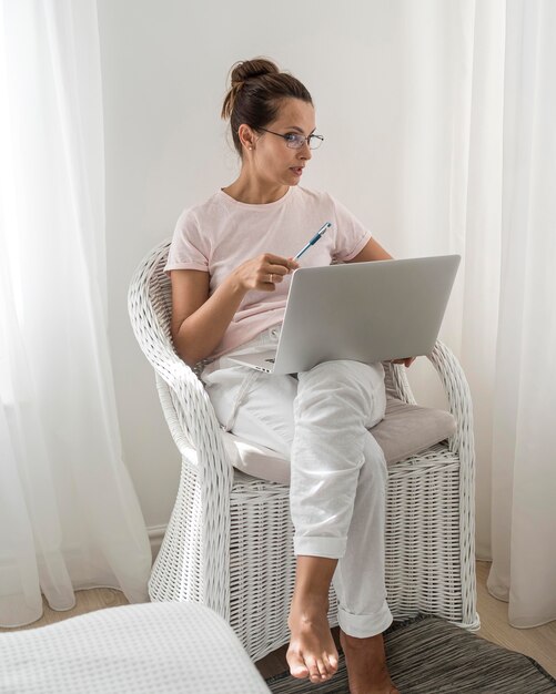 Casual adult woman working at home