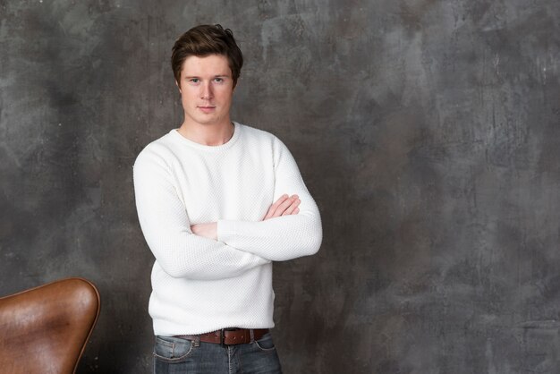 Casual man posing indoors with copy space