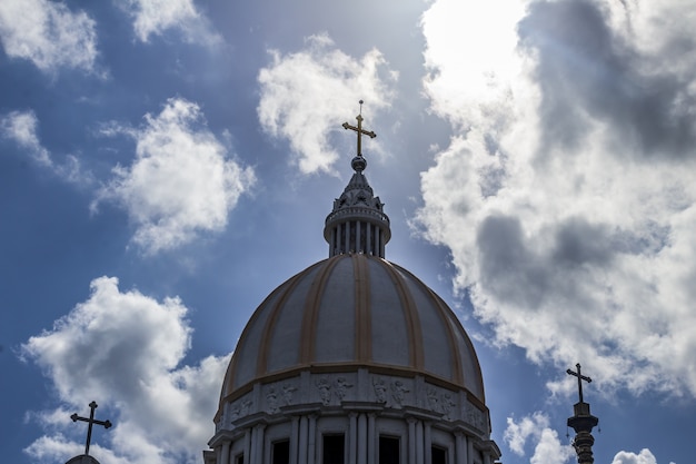 Free photo catholic church with clouds in the background