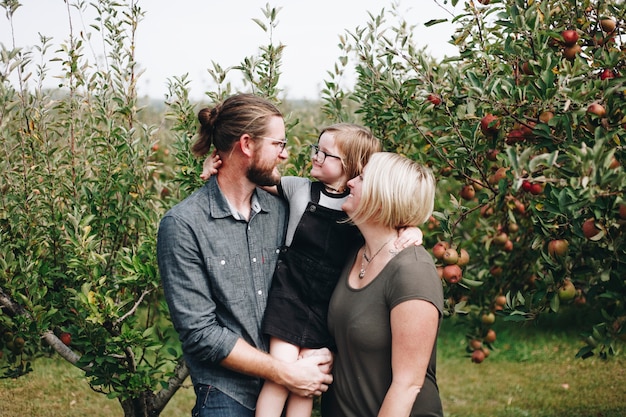 Free photo a caucasian family is spending time at the farm together