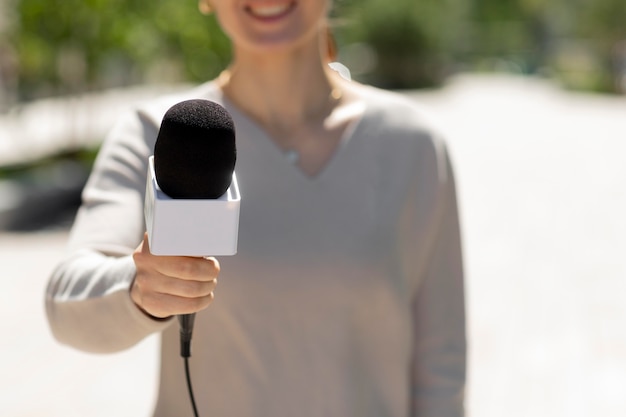 Free Photo caucasian female journalist outdoors