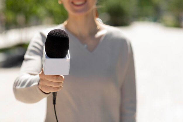 Caucasian female journalist outdoors