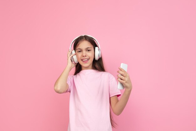 Caucasian little girl portrait isolated on pink, emotions concept