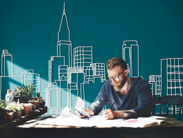 Caucasian man working with building illustration on green background