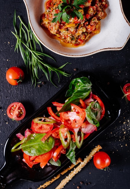 Caucasian mangal salad with tomato oregano mix.