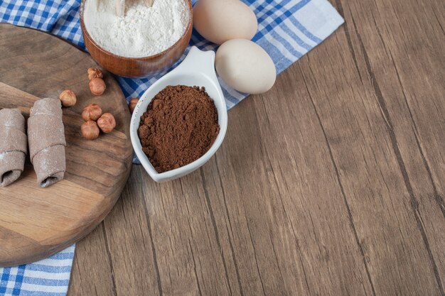 Caucasian mutaki wrap cookies with cinnamon on a wooden board.