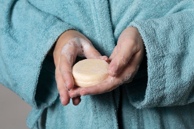 Caucasian person washing hands with soap