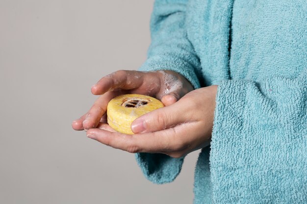 Caucasian person washing hands with soap