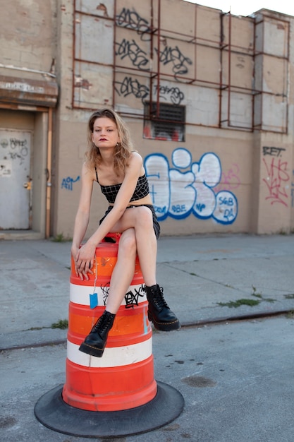 Free photo caucasian punk female with attitude in urban location