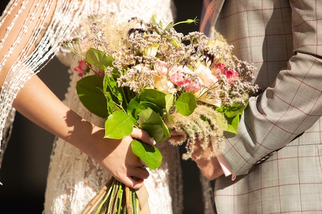 Caucasian romantic young couple celebrating their marriage in city.