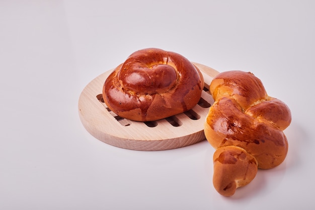 Caucasian style pastry buns on a wooden platter