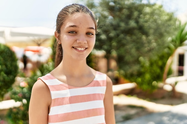 Caucasian teenager girl smiling happy standing at the city.