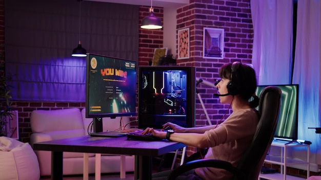 Free Photo caucasian woman celebrating winning first place in action game online multiplayer competition from home. gamer girl playing space shooter simulation on professional pc setup with gaming keyboard.