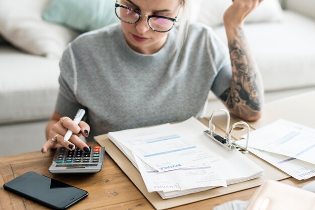 Caucasian woman with invoice bills