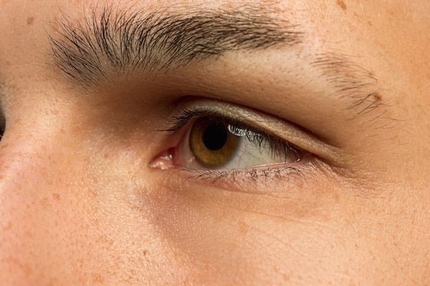 Caucasian young man's close up shot. Beautiful model with well-kept skin