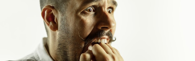 Free Photo caucasian young man's close up shot on studio background, flyer. concept of human emotions, facial expression, sales, ad. copyspace. beautiful male model with bright expressive emotion.