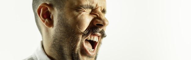 Free photo caucasian young mans close up cropped shot on studio wall flyer