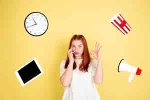 Free photo caucasian young woman's portrait on yellow background, too much tasks