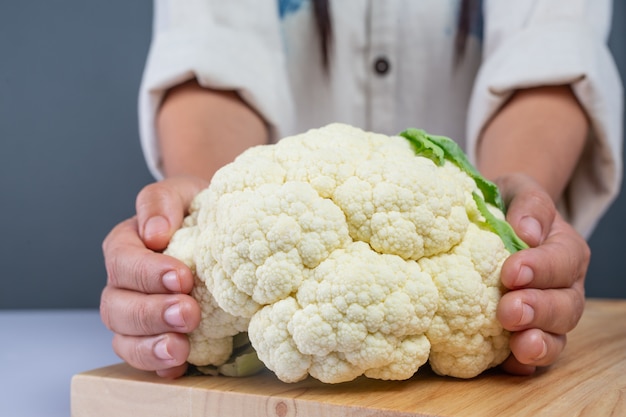 Cauliflower on the wooden floor.