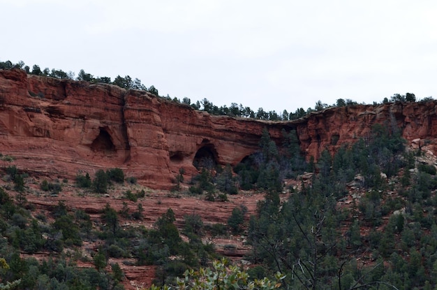 Free photo caves and caverns in the red rock cliffs