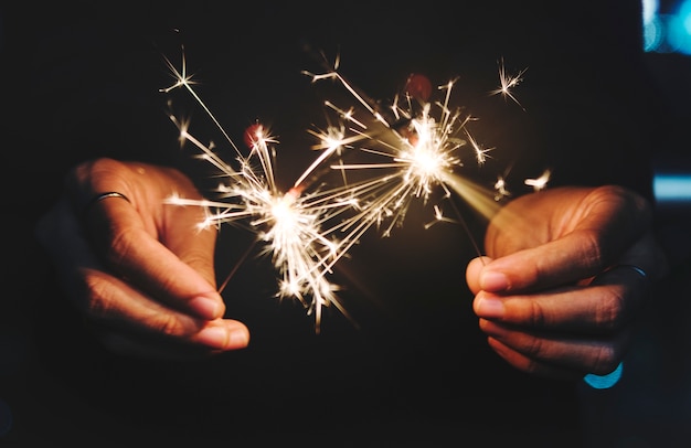 Free Photo celebrating with sparklers in the night