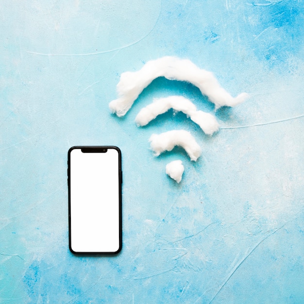 Free photo cell phone with white screen and wifi symbol on grunge background