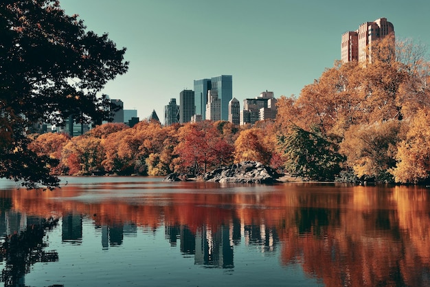 Central Park Autumn and buildings reflection in midtown Manhattan New York City