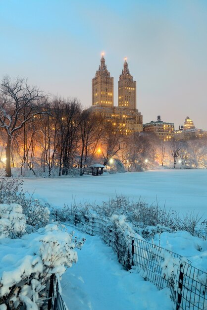 Central Park winter at night with skyscrapers in midtown Manhattan New York City