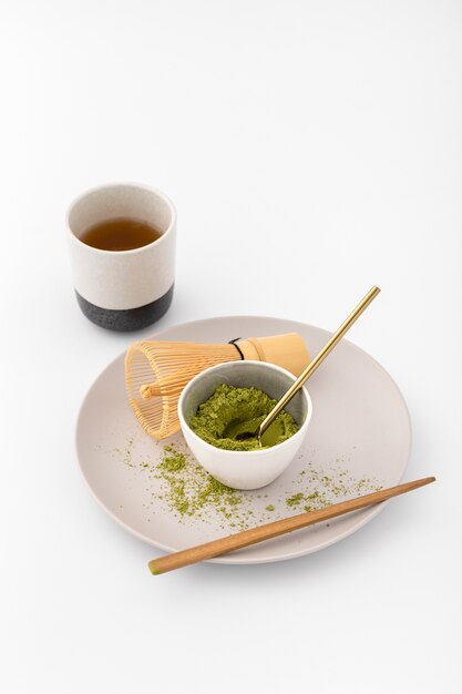 Ceramic bowl filled with matcha tea powder