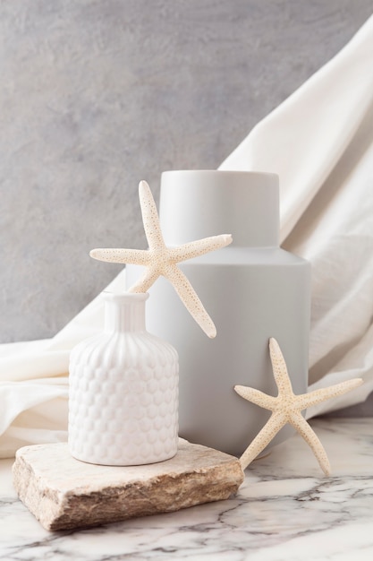 Free Photo ceramic vases with starfish