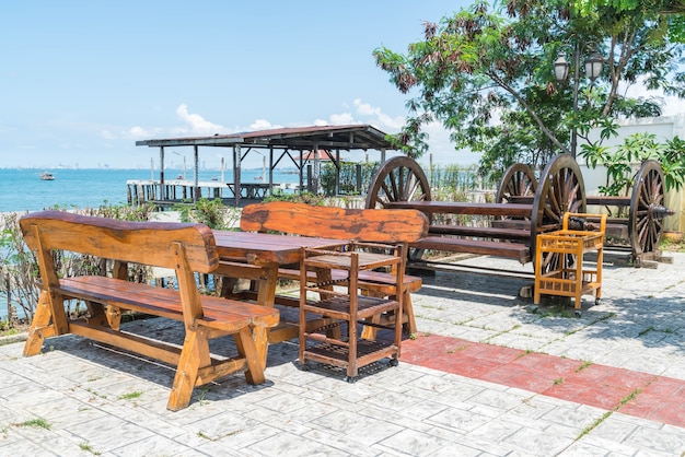 Free photo chair and table at terrace restaurant with sea view