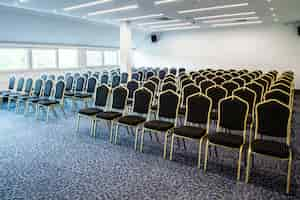 Free photo chairs in a row in congress hall with no people