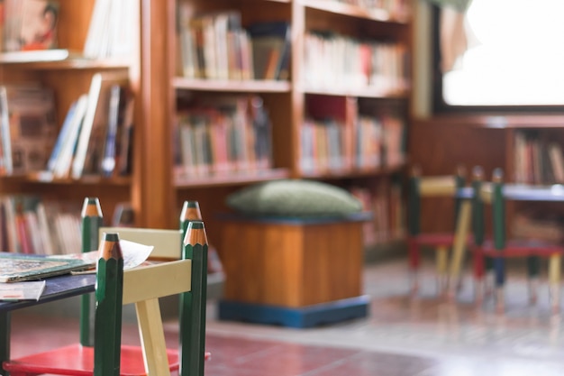 Free photo chairs and table in kids library