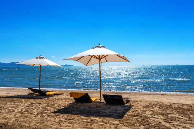 Chairs and umbrella on a tropical beach.