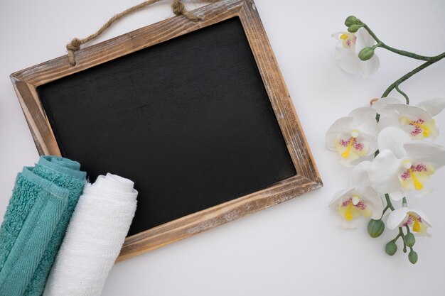 Chalkboard, towels and flowers