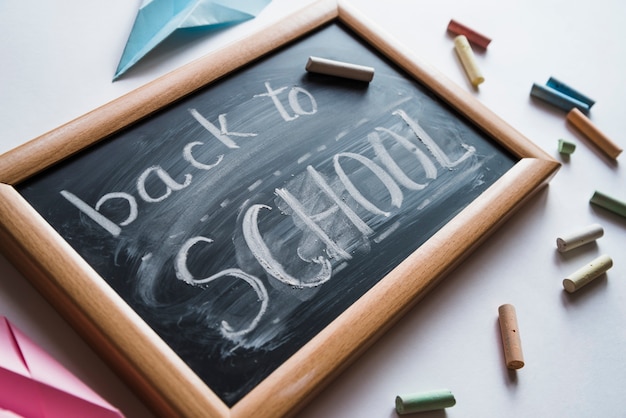 Free Photo chalkboard with white back to school sign