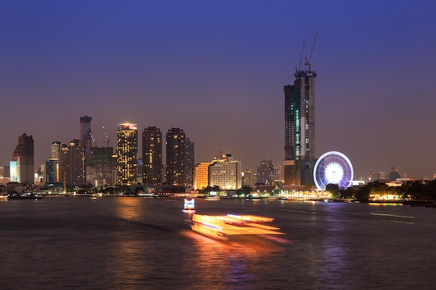 Chao phraya river and Bangkok cityscape at twilight