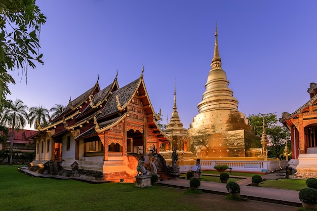 Free Photo chapel and golden pagoda at wat phra singh woramahawihan in chiang mai at twilight or night with stars in sky