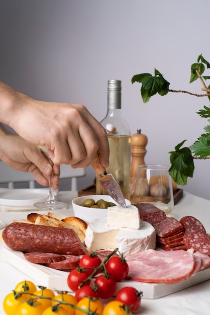 Free Photo charcuterie with assortment of meats and bread