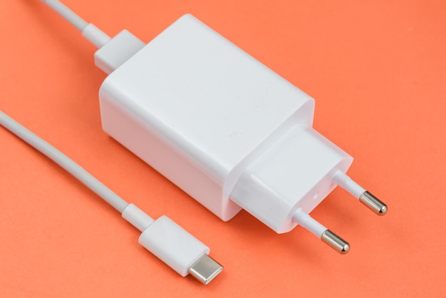 Free Photo charger and usb cable type c over red background